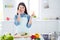 Portrait of positive woman caring house wife want prepare tasty supper breakfast for her family hold cucumber slice