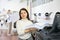 Portrait of positive woman printing office worker