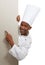 Portrait, poster and hand pointing by black man chef in studio for checklist, menu or space on white background. Bakery