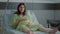 Portrait of pregnant caucasian woman sitting in hospital ward