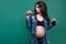 Portrait of pregnant woman with fast food