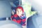 Portrait of preschool kid boy sitting in car