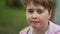 Portrait of preschooler child outdoors, girl is smiling