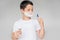 portrait of preteen boy with razor brush shaving foam on face