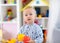 Portrait of pretty baby boy in kindergarten. Nursery child is happy