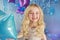 Portrait of Pretty blonde little girl with color balloons
