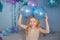 Portrait of Pretty blonde little girl with a color balloons