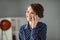 Portrait of pretty cheerful brown-haired girl calling client partner discussing it project at workplace workstation