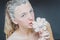 Portrait of pretty girl eating marshmallows. art photo. powdered sugar