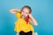 Portrait of a pretty little girl with fresh vegetables yellow and red pepper