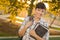 Portrait of a Pretty Mixed Race Female Student Holding Books