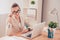 Portrait of pretty smart woman in glasses working in office