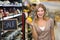 Portrait of a pretty smiling blonde woman buying vegetables