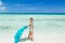 Portrait of pretty styled happy smiling fashionable little girl standing on the beach