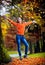 Portrait of pretty teen girl in autumn park