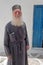 The portrait of a priest of Church of Assumption of the Virgin Mary in Naoussa, Paros, Greece