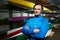 Portrait of professional Caucasian male canoeist standing against boats