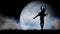 Portrait of professional dancers. Close up shot of ballet dancers performing on full moon background, fantasy scene