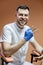 Portrait of professional dentist sits in a chair near a dental microscope