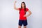 Portrait of professional footballer girl show her muscles europe match championship victory best team concept wear red t