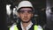 Portrait of Professional Heavy Industry Engineer or Worker Wearing Safety Uniform, Goggles and Hard Hat Looks at Camera