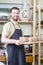 Portrait of Professional Male Ceramist Holding Tray with Clay Cups