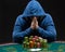 Portrait of a professional poker player sitting at pokers table