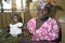 Portrait proud mother with child in Ghanaian hospital