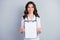 Portrait of qualified successful practitioner cardiologist girl hold clip board show corona medication
