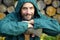 Portrait of a real bearded man with an axe. Bearded lumberjack with an ax in his hand. A man with an ax against the background of