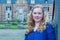 Portrait of red-haired girl with castle background