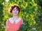 Portrait of a red-haired happy girl in park