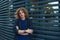 Portrait of red haired man over urban futuristic background