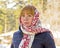 Portrait of a redheaded girl in a bright scarf.