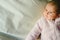 Portrait of relaxed baby girl with pink pajamas