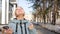 Portrait of a relaxed woman breathing deeply in a spring city park.