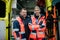 Portrait of rescuers in front of ambulance car.