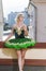 Portrait of Resting Professional Caucasian Ballerina in Green Tutu Dress Ourdoors