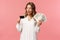 Portrait of rich good-looking blond girl in white dress, holding dollars money and credit card, winning lottery, think