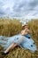 Portrait of romantic woman in a wheat field