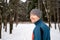 Portrait of a runner from the back, dressed in warm sportswear and preparing to run