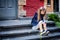 Portrait of a sad beautiful young schoolgirl is crying at the door of the school. does not want to go to school