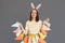 Portrait of sad despair Caucasian woman wearing rabbit ears holding Easter decorations in hands, being in bad mood, looks