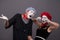 Portrait of sad mime couple crying isolated on