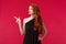 Portrait of sad and pity cute redhead woman in elegant black dress, sympathizing showing empathy, grimacing distressed