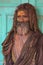 Portrait of a Sadhu Baba with colourful Face at Nandgaon Temple during Holi Festival,Uttarpradesh,India