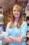 Portrait Of Sales Assistant At Supermarket Checkout