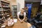 Portrait of salesman leaning at cash counter in supermarket