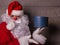 Portrait of Santa Claus with a box of gifts in his hands