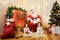 Portrait of Santa Claus and girl twin babies,child in the room b